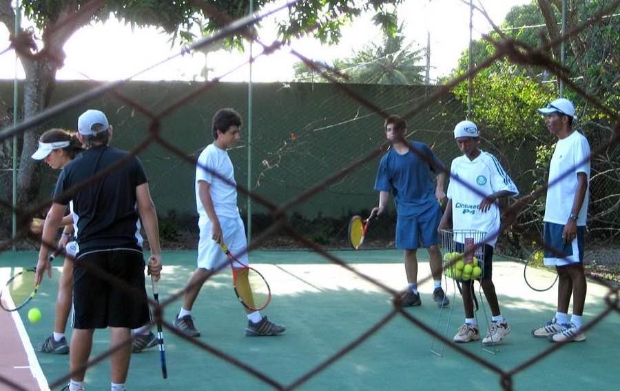 players holding paddles at the start of a pickleball training session